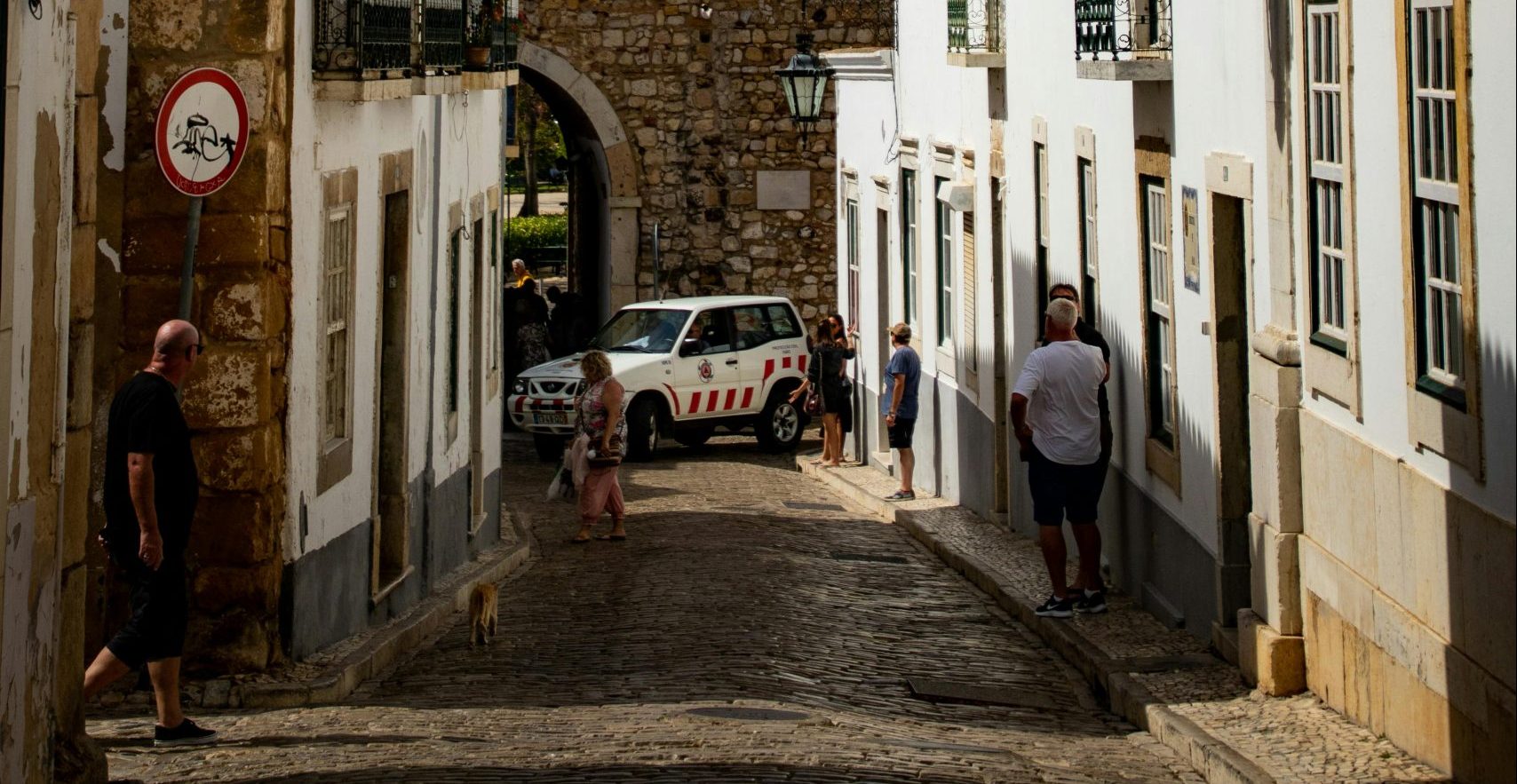 Man walking down the street in Faro district Portugal